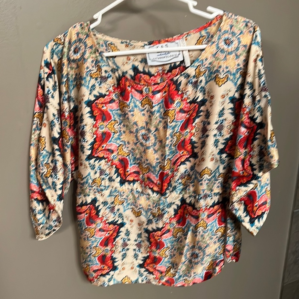 Beautiful blouse.  Too small for me.  True to size but I am an 8.